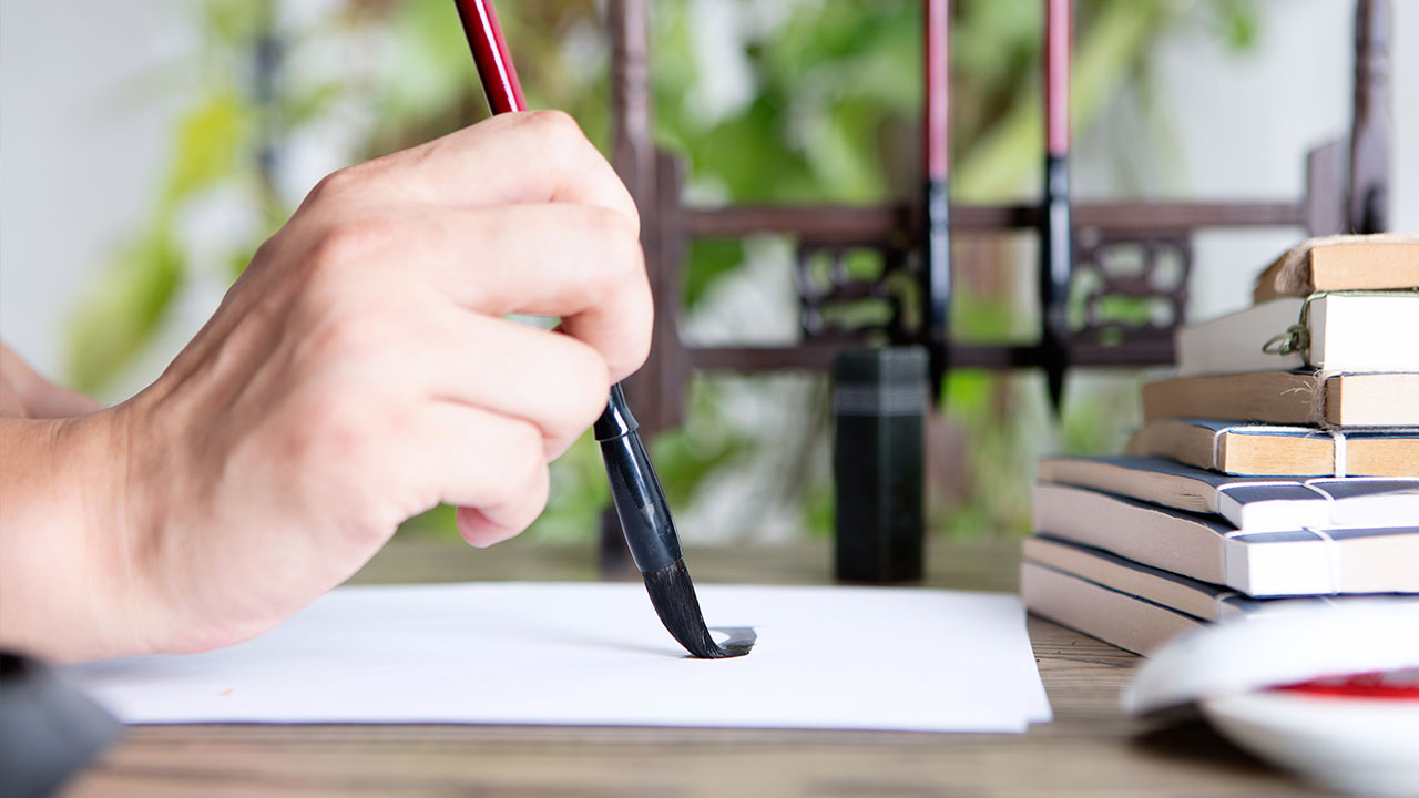 Soft dreamy image of bright candlelight from burning tea light c
